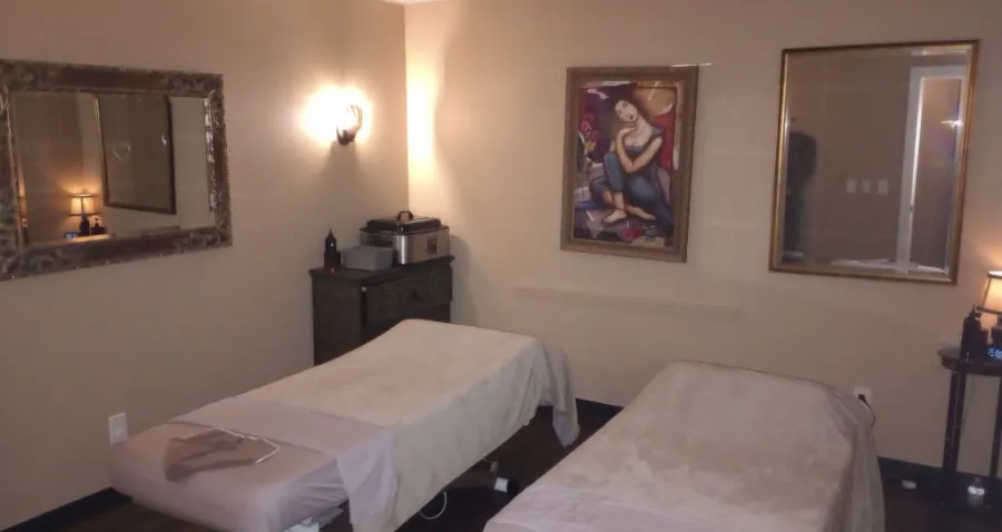 Couples massage tables with artwork