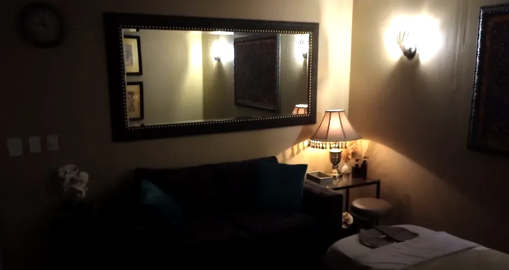 Couches and mirror inside the couples suite